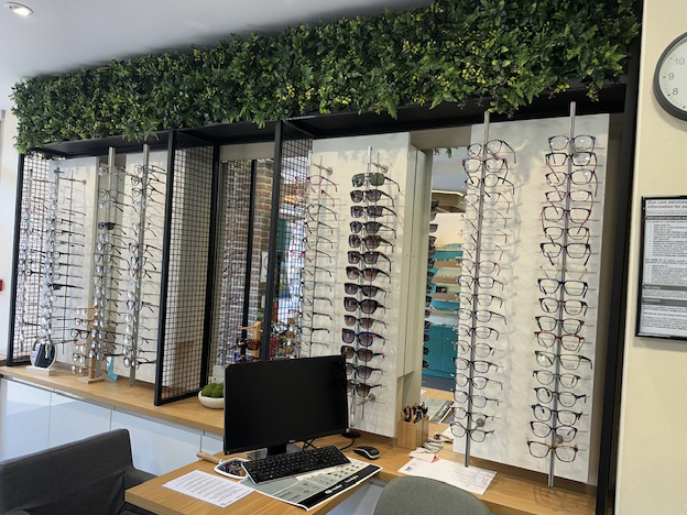 Retail displays of glasses and reception desk at Hassocks Eyecare